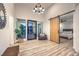 Welcoming entryway with a sliding barn door, modern light fixture, and view of the bedroom at 3731 Caesars Cir, Las Vegas, NV 89120