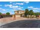 Two-story house with gated entry and landscaping at 6004 Chessington Ave, Las Vegas, NV 89131