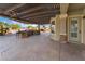 Outdoor kitchen with grill, cabinetry, and bar seating at 6004 Chessington Ave, Las Vegas, NV 89131