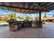 Covered outdoor kitchen with stainless steel appliances at 6004 Chessington Ave, Las Vegas, NV 89131