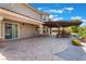 Spacious patio with pergola, outdoor kitchen, and seating area at 6004 Chessington Ave, Las Vegas, NV 89131