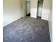 Simple bedroom with neutral carpeting and a double closet at 5713 Lawrence St, North Las Vegas, NV 89081