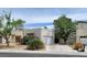 Charming stucco home with a two car garage and mature trees at 3805 Twig Ln, Las Vegas, NV 89108