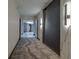 Residential hallway with wall sconces and carpeting at 3111 Bel Air Dr # 17A, Las Vegas, NV 89109