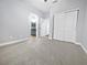 Bright bedroom with double doors leading to the bathroom at 2633 Romanesque Queen St, Henderson, NV 89044