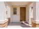 Front entry with brown door and welcome mat at 113 Parliament Cyn, Mesquite, NV 89027