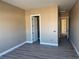 Simple bedroom with hardwood floors and a walk-in closet at 3080 S Prairie Ave, Pahrump, NV 89048