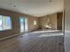 Spacious living room with hardwood floors and french doors at 3080 S Prairie Ave, Pahrump, NV 89048