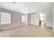 Spacious living room featuring tile floors and views to kitchen at 6608 Trout Peak Way, Las Vegas, NV 89156