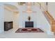 Spacious entryway with a dramatic staircase and a large chandelier at 6102 Rio Nevada Way, Las Vegas, NV 89113