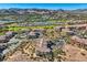 Community overview featuring a golf course and lake at 18 Via Visione # 106, Henderson, NV 89011