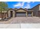 Two-story house with three-car garage and brick driveway at 246 Polaris Ridge Ave, Henderson, NV 89011