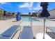 Community pool with lounge chairs and umbrellas at 246 Polaris Ridge Ave, Henderson, NV 89011