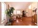 Bright living room with hardwood floors, comfy furniture and large windows at 1834 Escondido Ter, Henderson, NV 89074