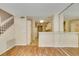 View of kitchen and dining area with laminate flooring and breakfast bar at 7732 Almeria Ave, Las Vegas, NV 89128