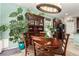 Well-lit dining area with large hutch and plants at 9271 Keystone Ridge Ave, Las Vegas, NV 89148