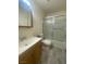 Clean bathroom with a tub shower combo and wood vanity at 3651 Brittlewood Ave, Las Vegas, NV 89120