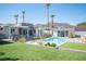 Landscaped backyard featuring a luxurious pool and patio area at 330 E Country Club Dr, Henderson, NV 89015