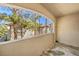 Spacious balcony with a view of the surrounding landscape and other buildings at 109 Breezy Tree Ct # 202, Las Vegas, NV 89145