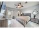 Main bedroom with king-size bed and access to balcony at 109 Breezy Tree Ct # 202, Las Vegas, NV 89145