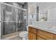 Modern bathroom with gray tile, a walk-in shower, and floating vanity at 11 Caminito Amore, Henderson, NV 89011