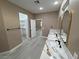 Double vanity bathroom with marble countertop and view of bedroom at 3231 Mount Charleston Dr, Pahrump, NV 89048