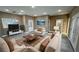 Virtually staged living room with beige sofas and a coffee table at 3231 Mount Charleston Dr, Pahrump, NV 89048