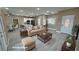 Virtually staged living room with beige sofa and coffee table at 3231 Mount Charleston Dr, Pahrump, NV 89048