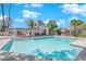 Community pool with a relaxing patio area and covered seating at 5543 Orchard Ln # 112, Las Vegas, NV 89110