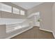 Loft area with windows and built-in shelving at 5543 Orchard Ln # 112, Las Vegas, NV 89110