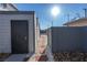 Private backyard with storage shed and stone pathway at 4485 S Nellis Blvd, Las Vegas, NV 89121