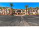 Two-story resort building with palm trees and parking lot at 555 Highland Dr # 228, Mesquite, NV 89027