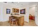 Wet bar with granite countertop and wooden cabinetry at 912 Santa Ynez Ave, Henderson, NV 89002