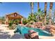 Refreshing pool with rock waterfall feature at 912 Santa Ynez Ave, Henderson, NV 89002