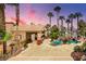 Luxury pool area with palm trees and a covered patio at 912 Santa Ynez Ave, Henderson, NV 89002