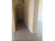 Clean hallway with neutral paint and new flooring at 9480 Santa Fe Rose St, Las Vegas, NV 89123