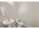 Clean powder room with pedestal sink and toilet at 10928 Mount Stellar St, Las Vegas, NV 89179