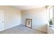 Bright bedroom featuring carpet, large window, and wall art at 1643 Coronado Ave, Las Vegas, NV 89169