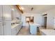 Modern kitchen with gray cabinets, an island, and views to the living room at 1643 Coronado Ave, Las Vegas, NV 89169