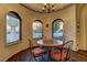 Charming breakfast nook with wood floors and arched windows at 928 Rhyolite Ter, Henderson, NV 89011