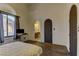 Bright bedroom with wood floors and ensuite bathroom at 928 Rhyolite Ter, Henderson, NV 89011