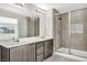 Elegant bathroom with double vanity and large shower at 9997 Blue Rain St, Las Vegas, NV 89178