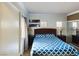 Condo bedroom with queen bed and mirrored closet at 230 E Flamingo Rd # 402, Las Vegas, NV 89169