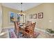 Formal dining room with a wood table and six chairs, and a tile floor at 536 E Fairway Rd, Henderson, NV 89015