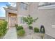 Inviting home exterior with landscaped walkway and front door at 10851 Piccata St, Las Vegas, NV 89141