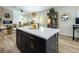 Large kitchen island with white countertop and gold hardware at 5317 Clover Blossom Ct, North Las Vegas, NV 89031