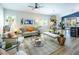 Open concept living room with a neutral color palette and modern decor at 5317 Clover Blossom Ct, North Las Vegas, NV 89031