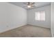 Well-lit bedroom with ceiling fan and window at 6736 Arctic Breeze St, North Las Vegas, NV 89084