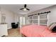 Bedroom with barn door and light coral bedding at 640 Badlands Ave, Henderson, NV 89012