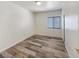 Bright bedroom with wood-look vinyl flooring and window at 5650 E Sahara Ave # 2049, Las Vegas, NV 89142